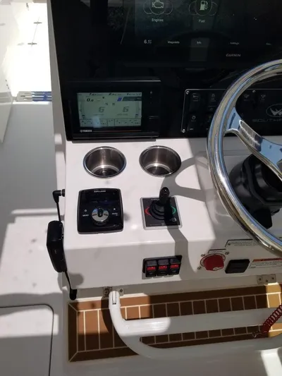 Nauti Nole Yacht Photos Pics 2021 Southport 33 DC helm with modern controls and steering wheel.