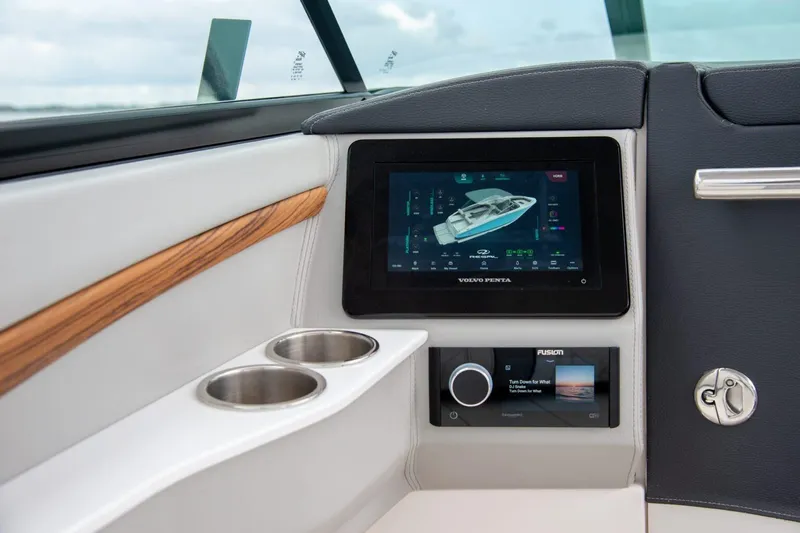  Yacht Photos Pics 2026 Regal LS9 boat dashboard with touchscreen display and cup holders.