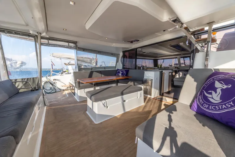 Spirit Of Ecstacy Yacht Photos Pics Interior of 2023 Fountaine Pajot Tanna 47 catamaran with spacious seating and modern design.