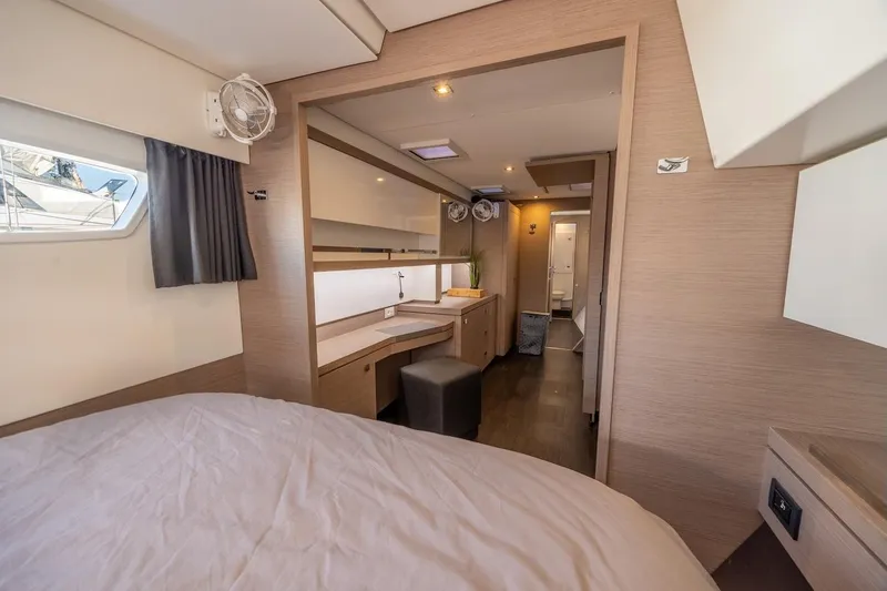 Spirit Of Ecstacy Yacht Photos Pics Luxurious interior of 2023 Fountaine Pajot Tanna 47 catamaran, featuring modern design and cozy cabin.