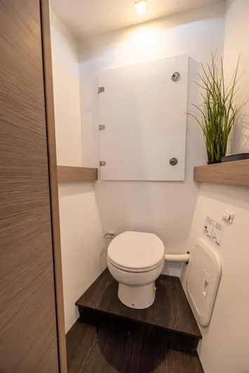 Spirit Of Ecstacy Yacht Photos Pics Modern bathroom in 2023 Fountaine Pajot Tanna 47 yacht with sleek design and plant decor.