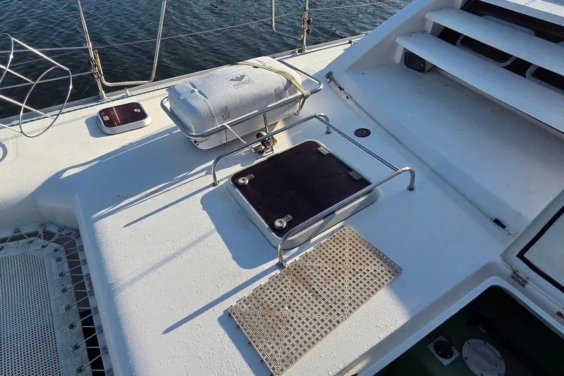 Beshert Yacht Photos Pics Deck of 2004 Leopard 47 catamaran with safety equipment and hatch.