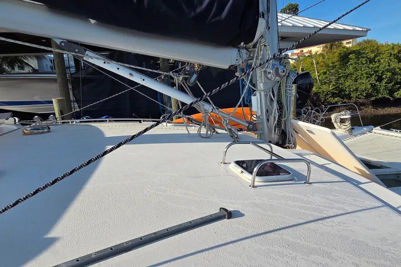 Beshert Yacht Photos Pics Deck view of a 2004 Leopard 47 catamaran with rigging and hatch details.