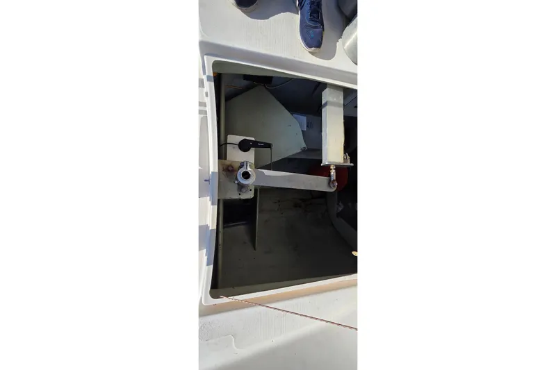 Beshert Yacht Photos Pics Open hatch of a 2004 Leopard 47 catamaran, showing interior mechanical components.