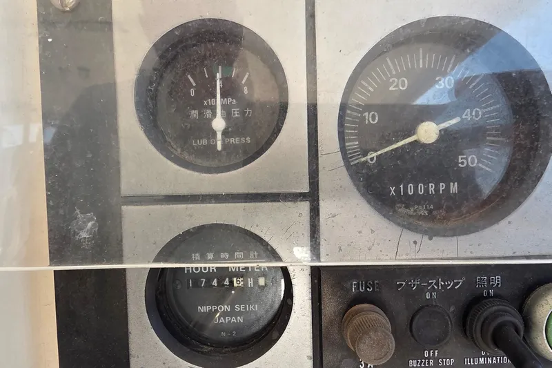 Beshert Yacht Photos Pics Close-up of a 2004 Leopard 47 control panel with gauges and switches.