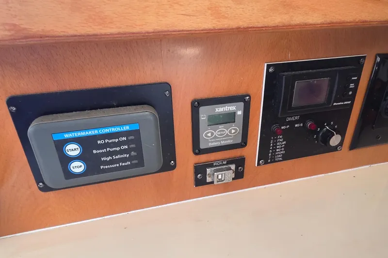 Beshert Yacht Photos Pics Control panel of a 2004 Leopard 47 yacht with watermaker and battery monitor.