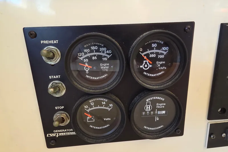 Beshert Yacht Photos Pics Control panel of a 2004 Leopard 47 with engine gauges and switches.