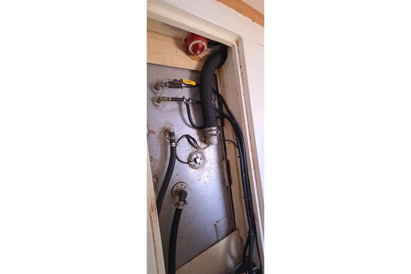 Beshert Yacht Photos Pics Engine compartment of a 2004 Leopard 47 yacht, showing hoses and fittings.