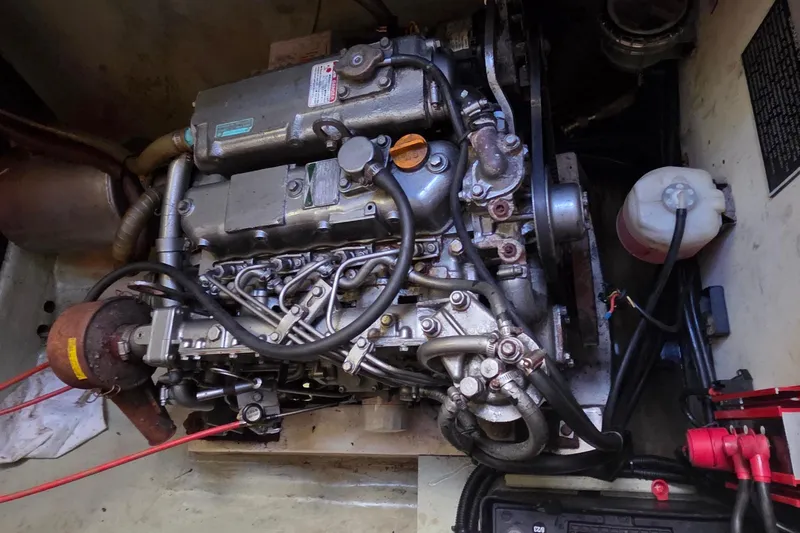 Beshert Yacht Photos Pics Engine compartment of a 2004 Leopard 47 catamaran, showcasing intricate mechanical components.