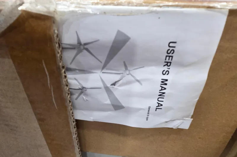 Beshert Yacht Photos Pics User manual for Leopard 47, 2004 model, partially visible in cardboard packaging.