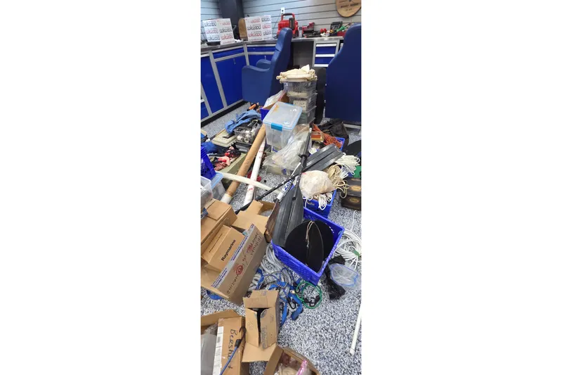 Beshert Yacht Photos Pics Messy workshop with tools and supplies, Leopard 47, 2004 model.