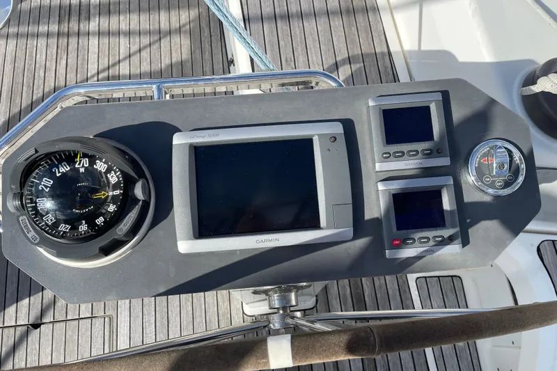 Seas The Day Yacht Photos Pics Helm of 2014 Bavaria Vision 46 sailboat with navigation instruments and compass.