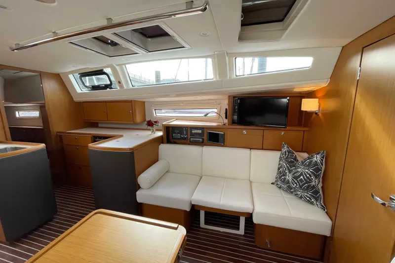 Seas The Day Yacht Photos Pics Luxurious interior of 2014 Bavaria Vision 46 yacht with modern furnishings and natural light.