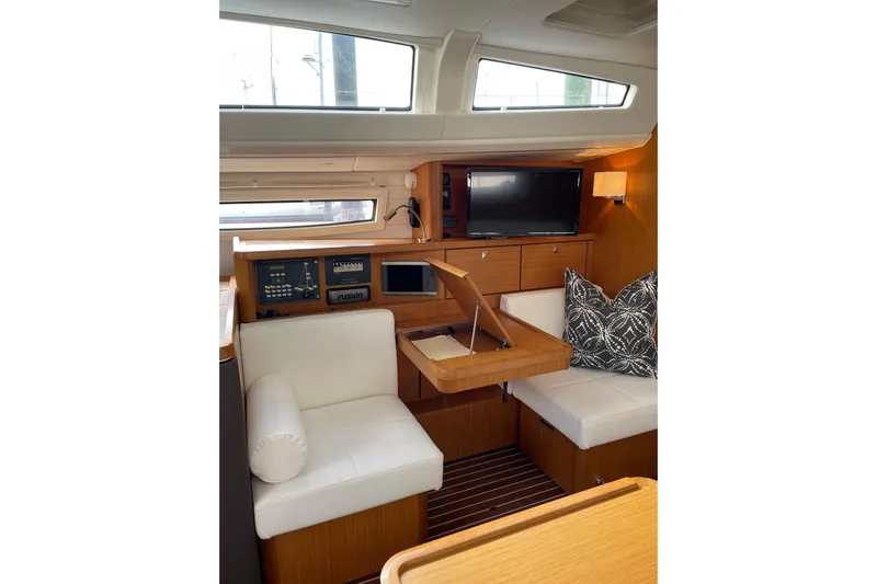 Seas The Day Yacht Photos Pics Interior of 2014 Bavaria Vision 46 yacht with modern seating and navigation equipment.