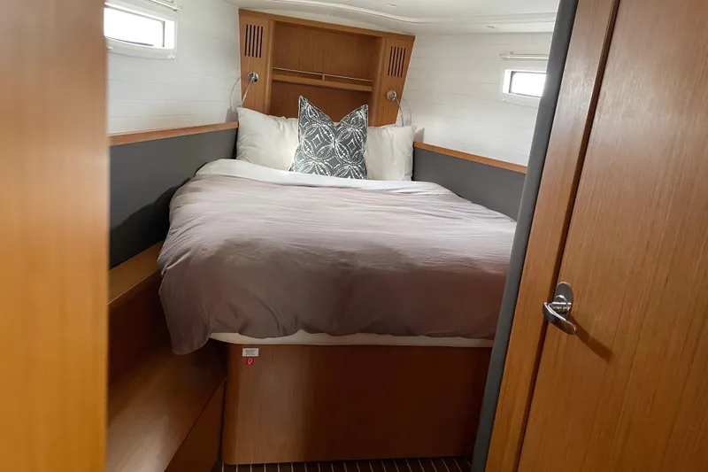 Seas The Day Yacht Photos Pics Cozy cabin interior of 2014 Bavaria Vision 46 yacht with comfortable bedding.