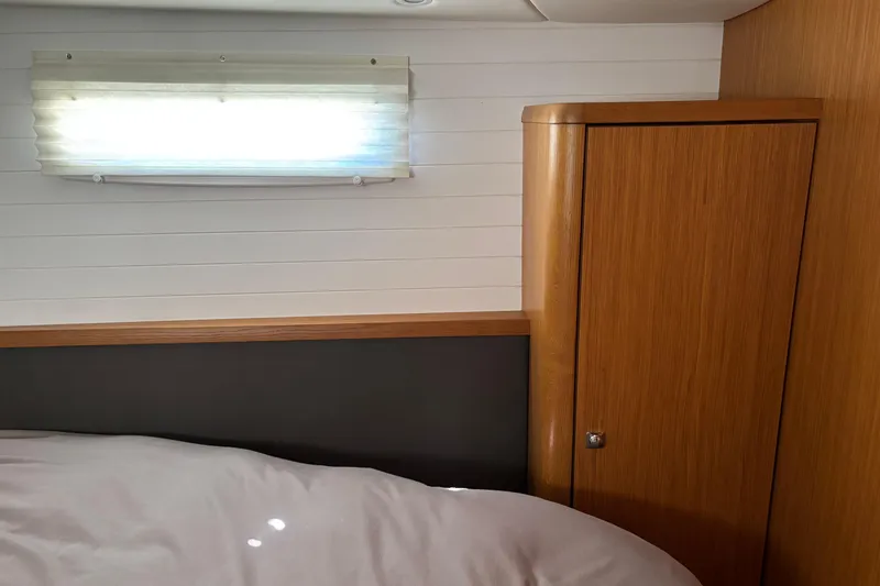 Seas The Day Yacht Photos Pics Interior of 2014 Bavaria Vision 46 yacht with wooden cabinet and window shade.