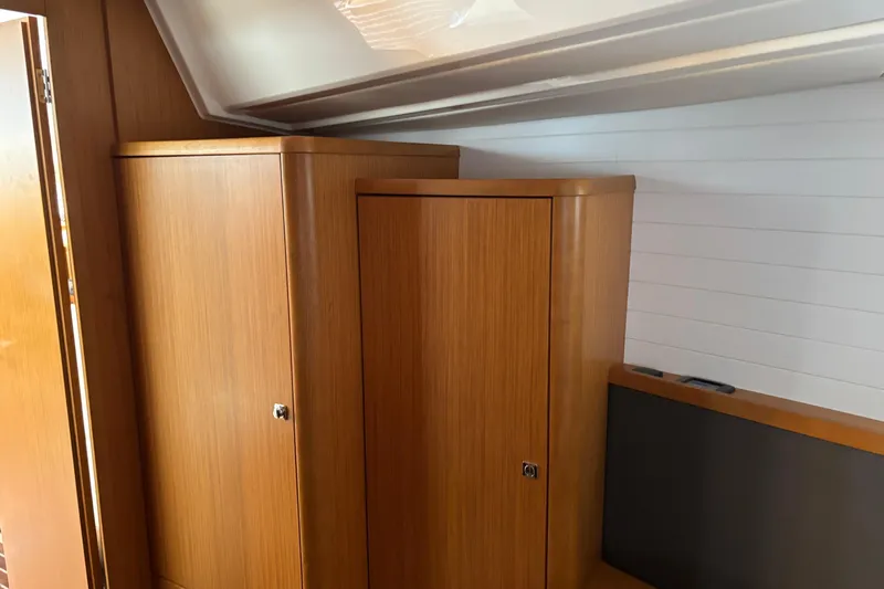 Seas The Day Yacht Photos Pics Interior wooden cabinetry of 2014 Bavaria Vision 46 yacht, showcasing sleek design and storage.
