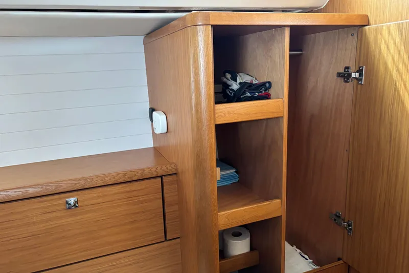 Seas The Day Yacht Photos Pics Wooden interior storage on 2014 Bavaria Vision 46 yacht with shelves and cabinet.