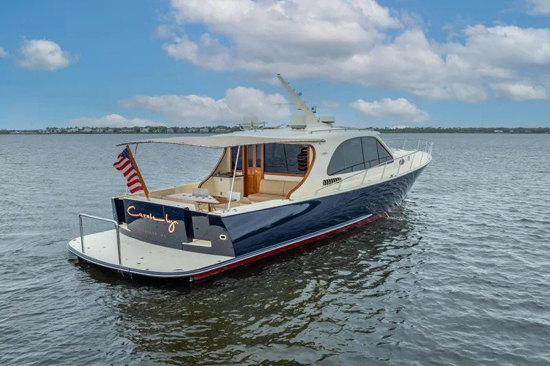 Carole Lyn Yacht Photos Pics 2018 Palm Beach Motor Yachts PB55 on calm water, showcasing elegant design and luxury features.