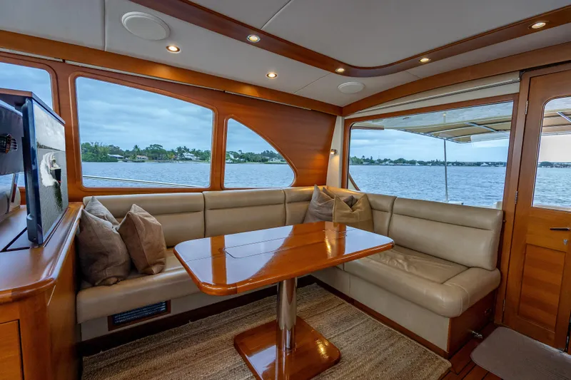 Carole Lyn Yacht Photos Pics Luxurious interior of 2018 Palm Beach Motor Yachts PB55 with elegant seating and scenic water view.