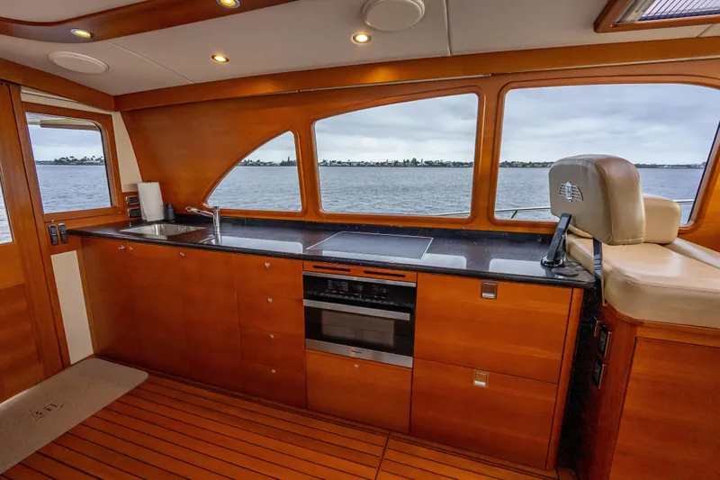 Carole Lyn Yacht Photos Pics Luxurious 2018 Palm Beach Motor Yachts PB55 interior with sleek kitchen and scenic ocean view.