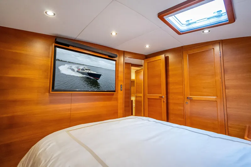 Carole Lyn Yacht Photos Pics Luxurious 2018 Palm Beach Motor Yachts PB55 cabin with elegant wood paneling and skylight.