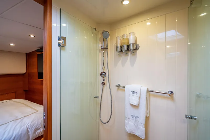 Carole Lyn Yacht Photos Pics Luxurious bathroom in 2018 Palm Beach Motor Yachts PB55, featuring modern shower and elegant design.