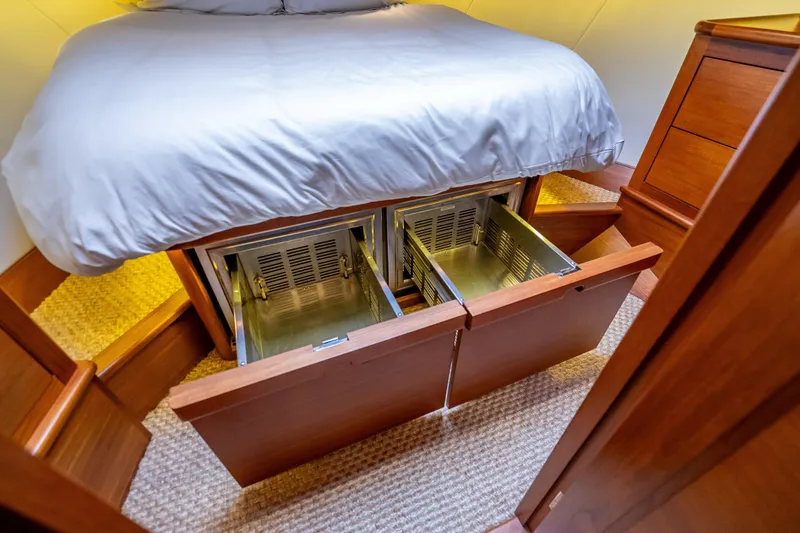 Carole Lyn Yacht Photos Pics 2018 Palm Beach Motor Yachts PB55 bedroom with under-bed storage drawers open.