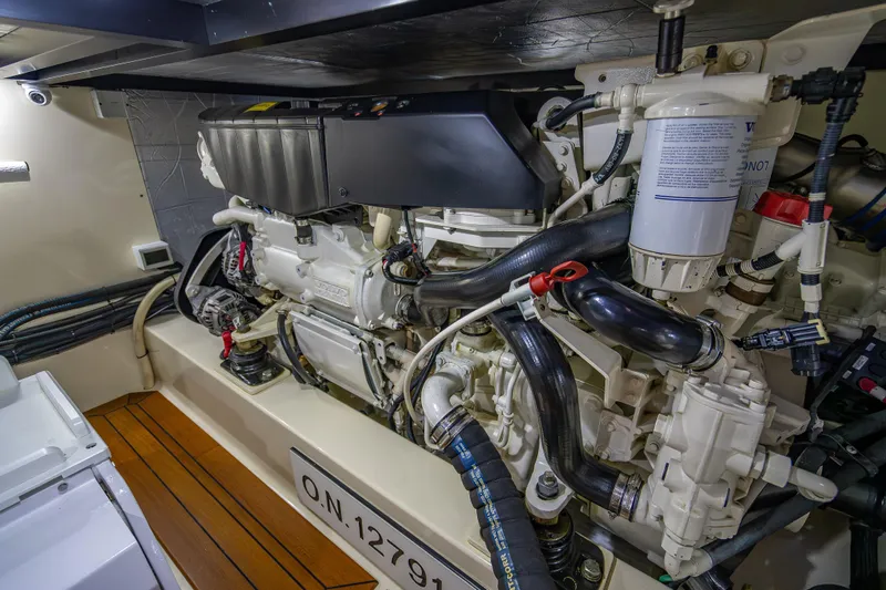 Carole Lyn Yacht Photos Pics Engine room of 2018 Palm Beach Motor Yachts PB55, showcasing detailed mechanical components.