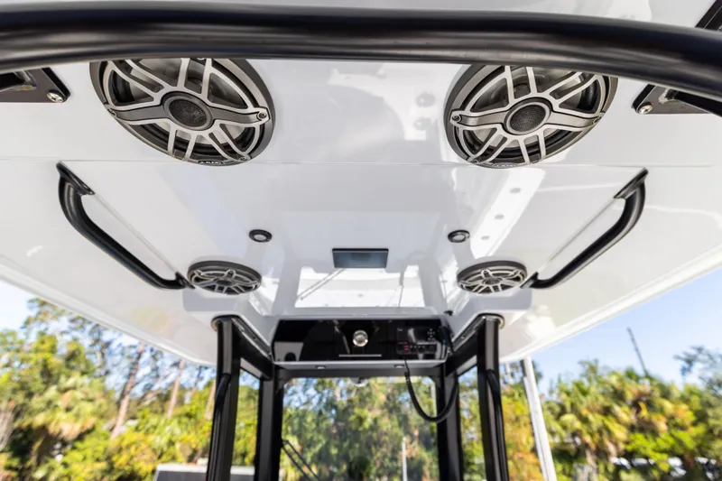  Yacht Photos Pics 2024 Freeman 28 boat speakers and canopy, outdoor setting.