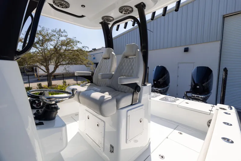  Yacht Photos Pics 2024 Freeman 28 boat interior with dual seats and modern controls.