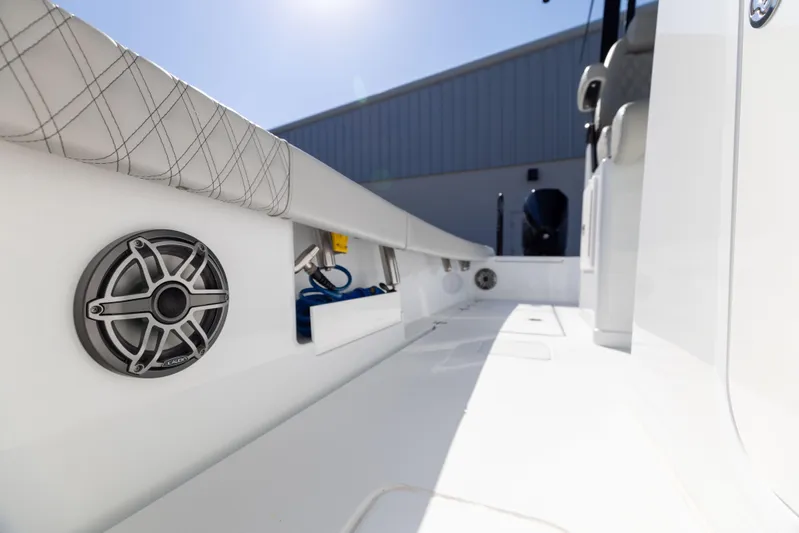  Yacht Photos Pics 2024 Freeman 28 boat interior with speaker and storage compartments.