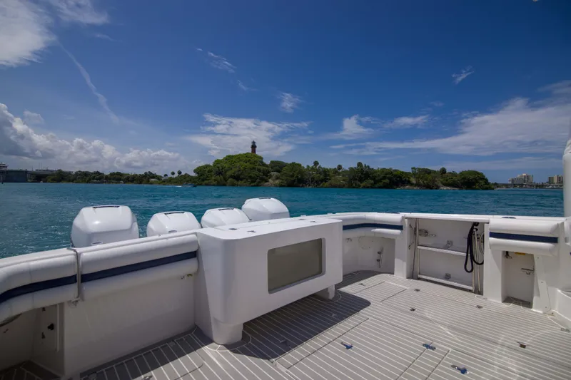 Sunkisser Yacht Photos Pics 2013 Intrepid 475 Sport Yacht deck with ocean view and clear blue sky.