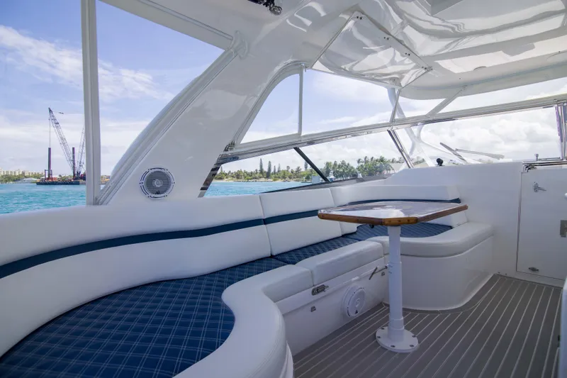 Sunkisser Yacht Photos Pics Luxurious interior of 2013 Intrepid 475 Sport Yacht with elegant seating and ocean view.