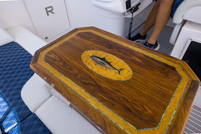 Sunkisser Yacht Photos Pics Luxurious wooden table with fish inlay on 2013 Intrepid 475 Sport Yacht.