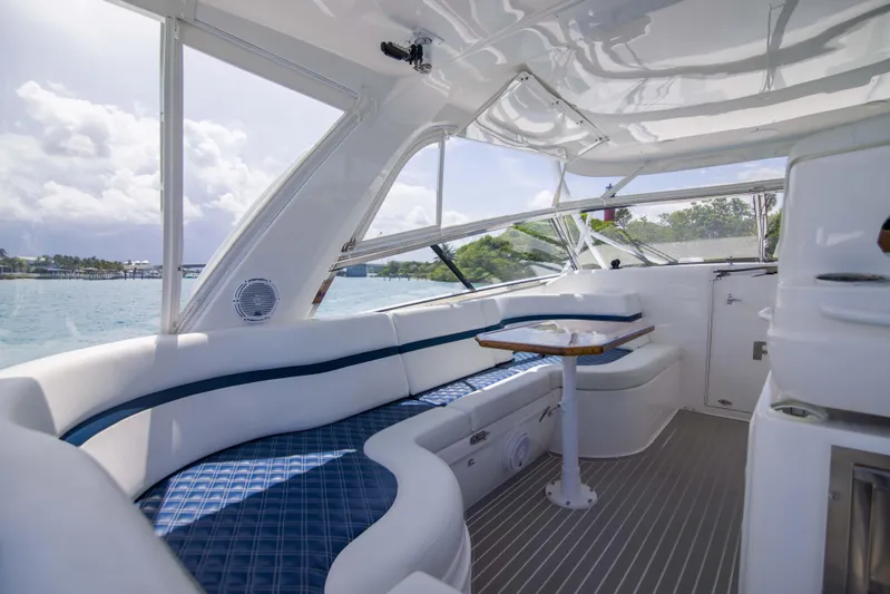 Sunkisser Yacht Photos Pics Luxurious interior of 2013 Intrepid 475 Sport Yacht with plush seating and scenic views.