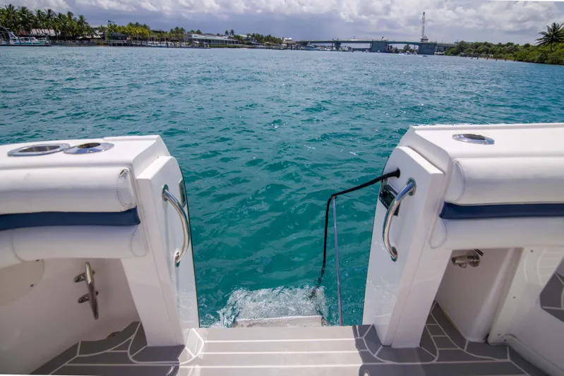 Sunkisser Yacht Photos Pics 2013 Intrepid 475 Sport Yacht stern view with ocean backdrop.