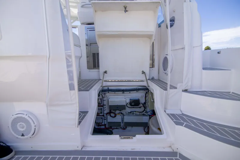 Sunkisser Yacht Photos Pics 2013 Intrepid 475 Sport Yacht engine compartment with open hatch and visible machinery.