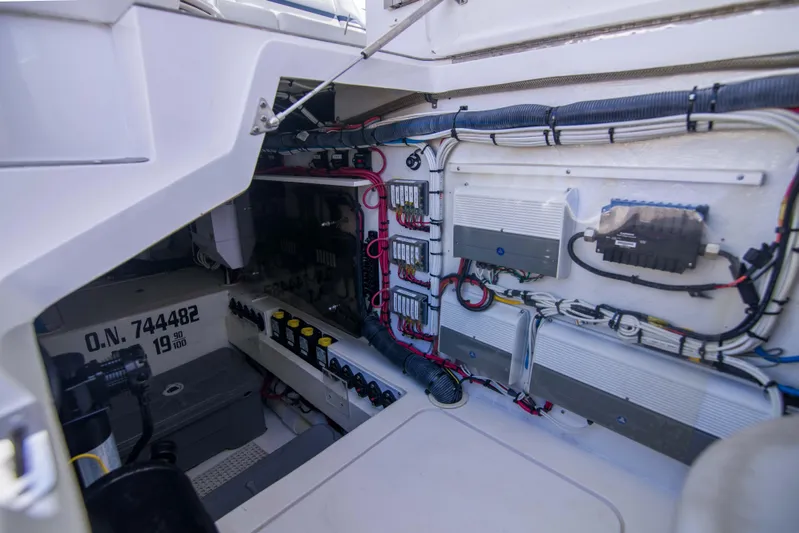 Sunkisser Yacht Photos Pics Engine room of 2013 Intrepid 475 Sport Yacht, showcasing wiring and equipment.