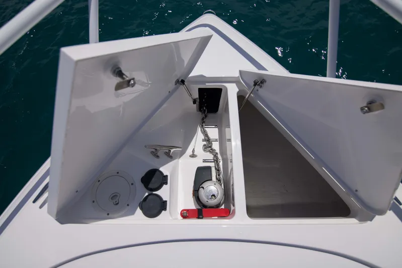 Sunkisser Yacht Photos Pics Open anchor compartment on 2013 Intrepid 475 Sport Yacht, showing chain and storage.