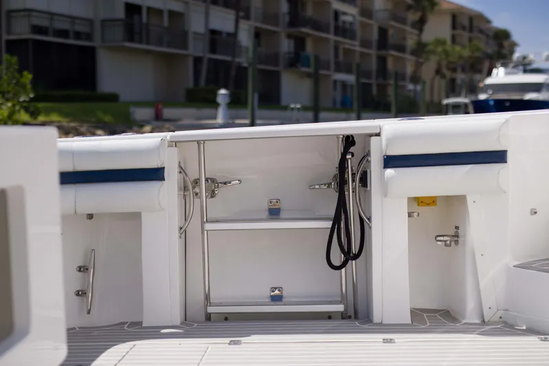 Sunkisser Yacht Photos Pics 2013 Intrepid 475 Sport Yacht deck with storage compartments and seating.