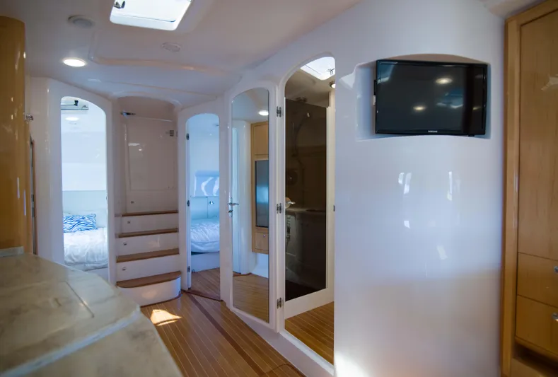Sunkisser Yacht Photos Pics Interior of 2013 Intrepid 475 Sport Yacht, featuring modern design and wooden flooring.