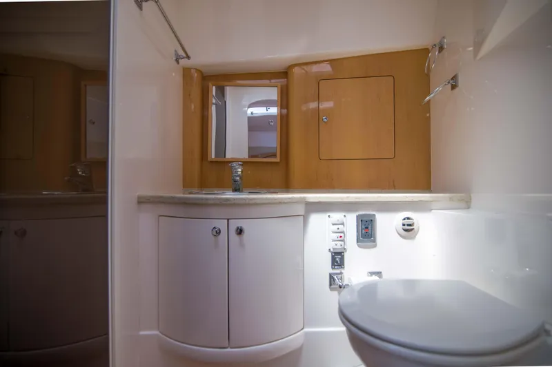 Sunkisser Yacht Photos Pics Luxurious bathroom interior of 2013 Intrepid 475 Sport Yacht with modern fixtures.