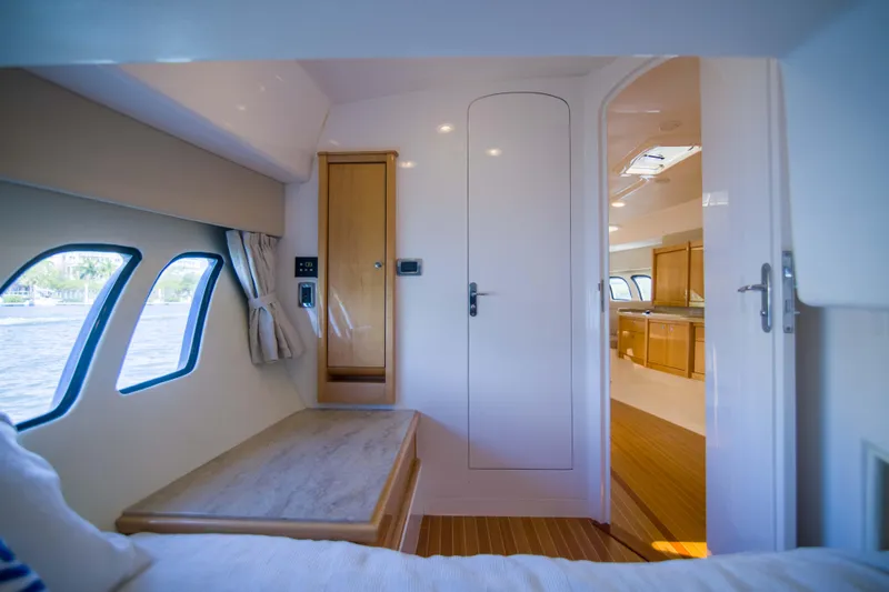 Sunkisser Yacht Photos Pics Interior of 2013 Intrepid 475 Sport Yacht, featuring sleek design and wooden cabinetry.