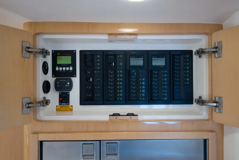 Sunkisser Yacht Photos Pics Electrical control panel inside 2013 Intrepid 475 Sport Yacht, featuring switches and displays.