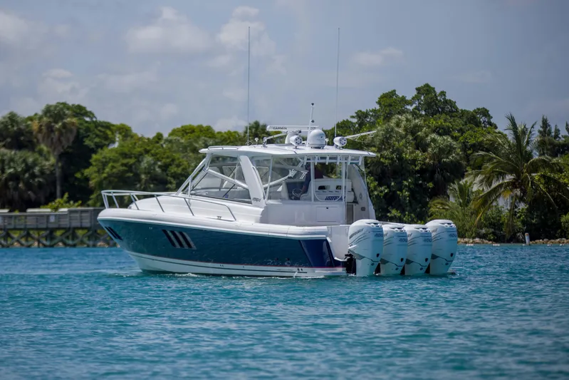 Sunkisser Yacht Photos Pics 2013 Intrepid 475 Sport Yacht on water, featuring four powerful outboard engines.