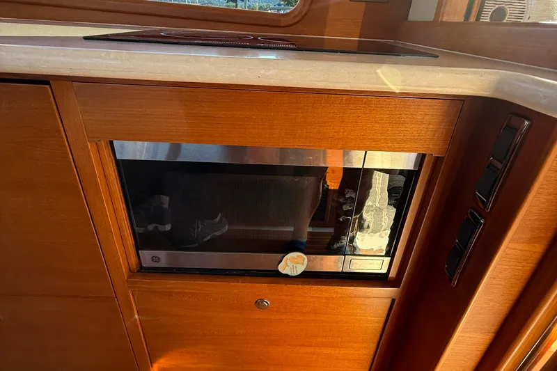  Yacht Photos Pics Built-in microwave in 2017 Grand Banks 44 Eastbay SX yacht kitchen.