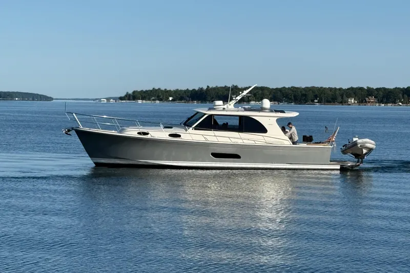  Yacht Photos Pics 2017 Grand Banks 44 Eastbay SX yacht cruising on a serene lake.