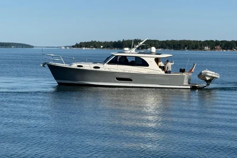  Yacht Photos Pics 2017 Grand Banks 44 Eastbay SX yacht cruising on calm waters.