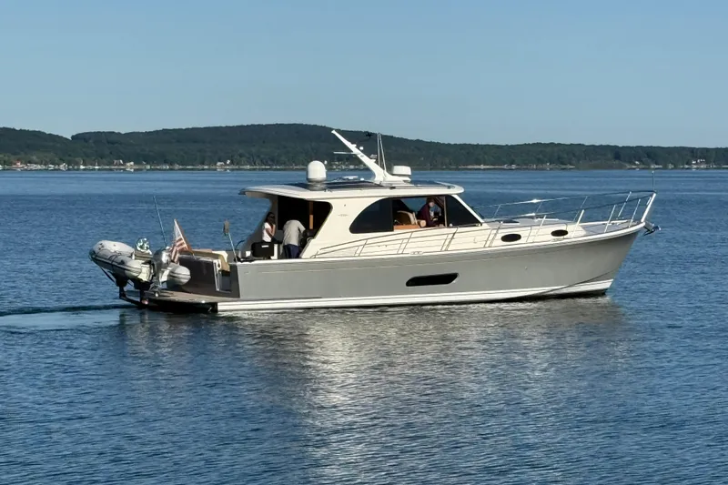  Yacht Photos Pics 2017 Grand Banks 44 Eastbay SX yacht cruising on calm waters.